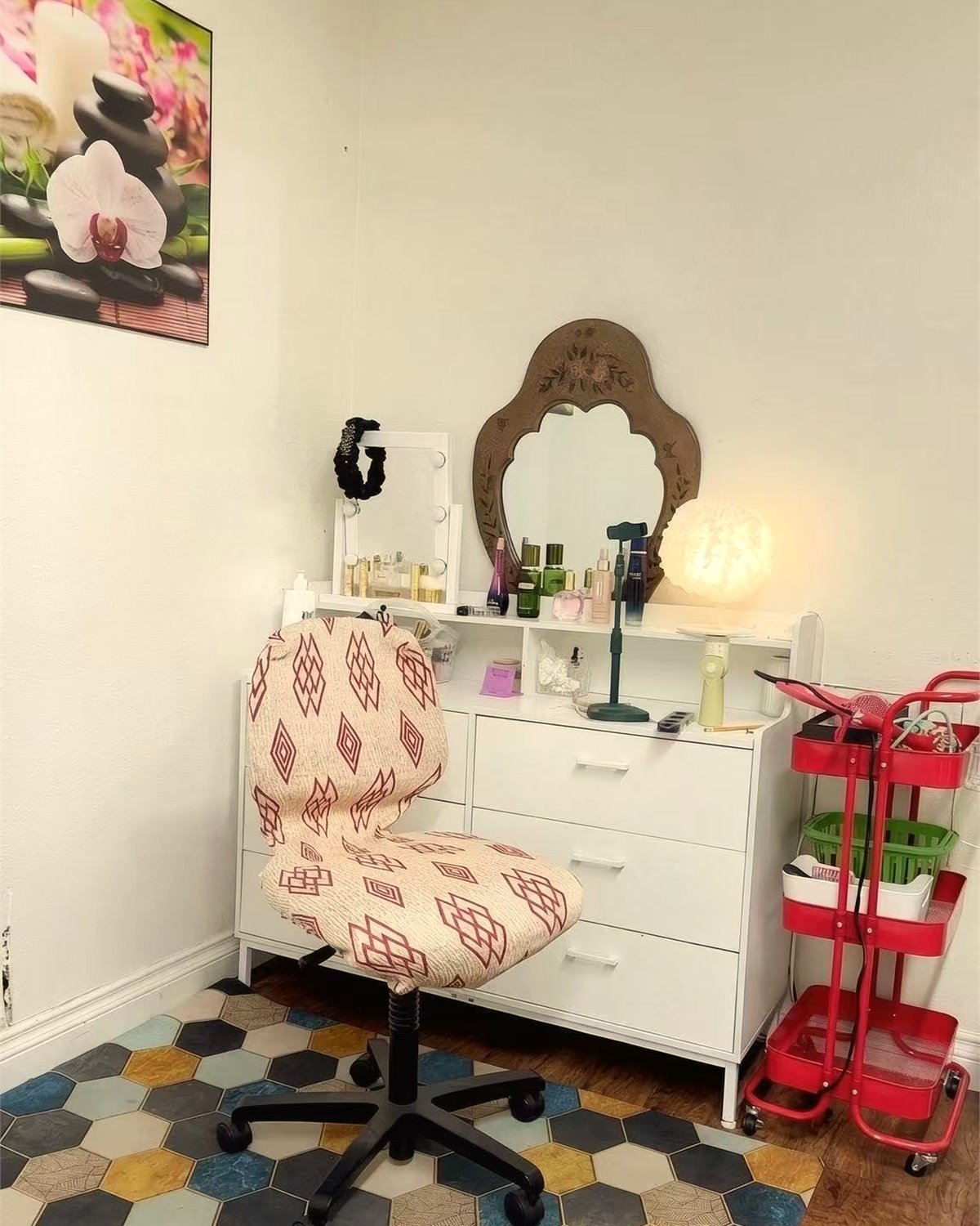 Care corner with mirror, chair, soft lamp, and neatly arranged supplies